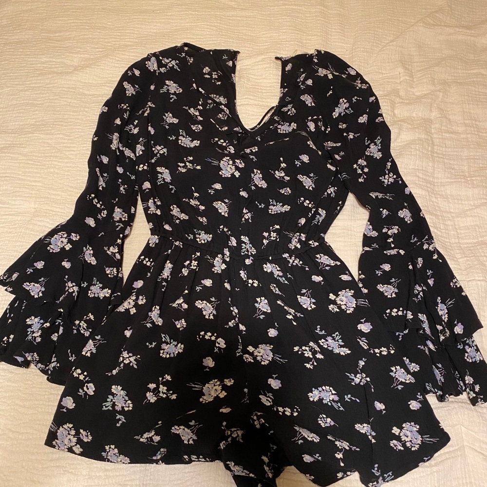 Black romper with floral design